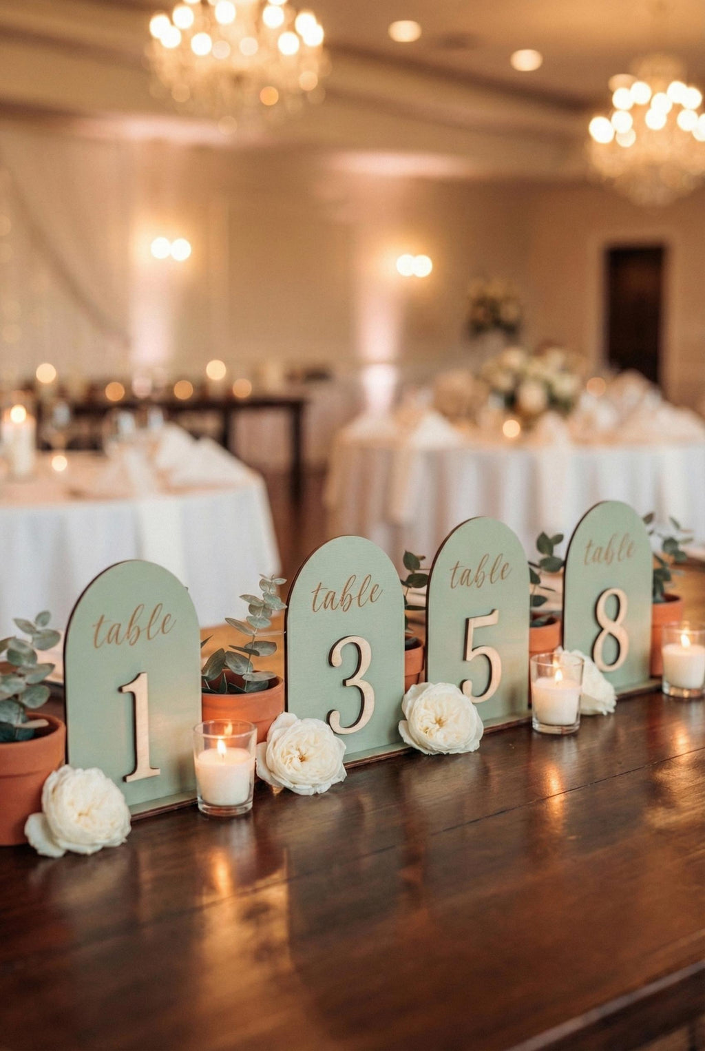 Arch wedding table number close-up showing laser engraving
