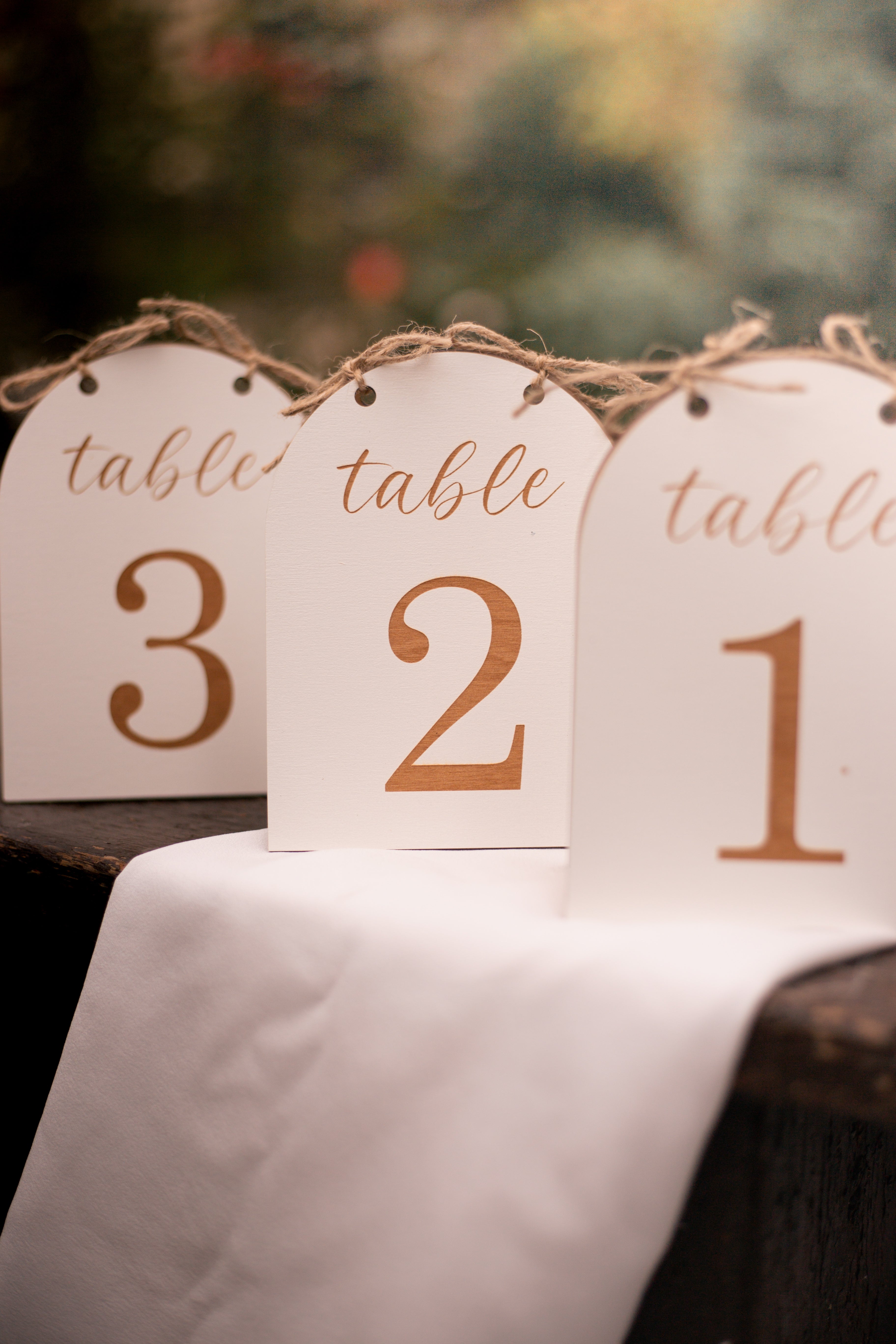 Custom rustic wedding table numbers with twine close-up detail
