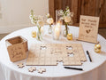 Personalized wooden wedding puzzle guest book where guests sign pieces
