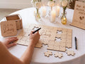 Personalized wooden wedding puzzle guest book where guests sign pieces
