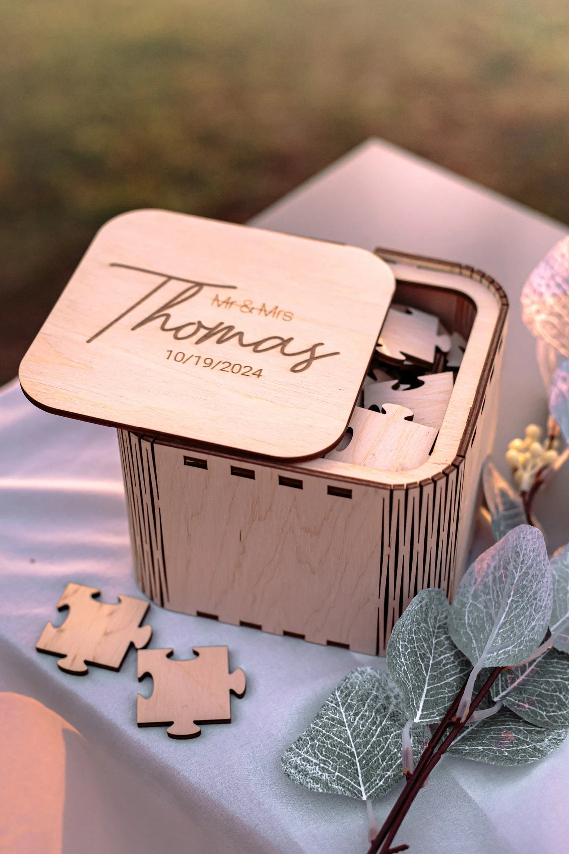 Wedding puzzle guest book pieces showing guest signatures
