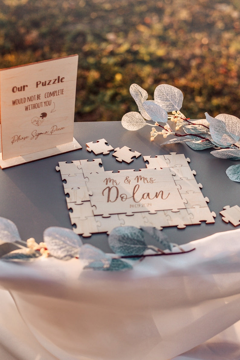 Personalized wooden wedding puzzle guest book where guests sign pieces
