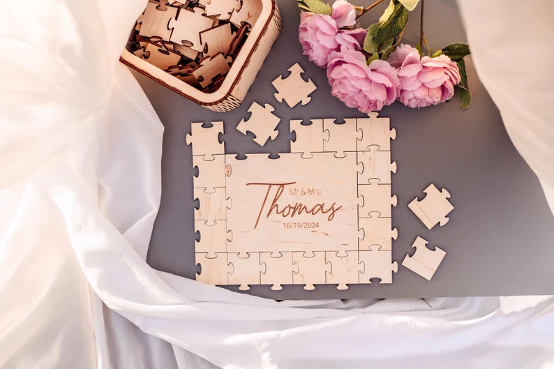 Wedding puzzle guest book pieces showing guest signatures

