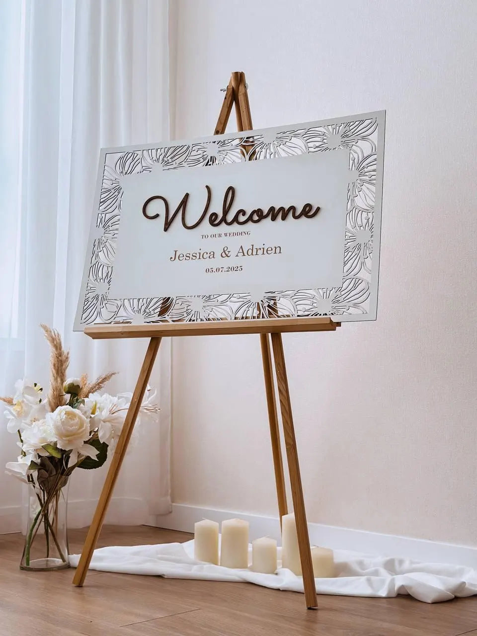 Custom floral wedding welcome board with names and date
